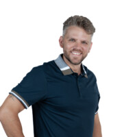 Positive headshot of businessman on white background. Business portrait of man with confident smile – studio headshot